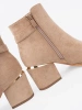 Elegant beige ankle boots with decorative buckle