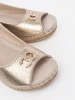 Gold wedge sandals with buckle