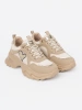Beige sneakers with decorative golden heart