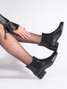 Black ankle boots with decorative heels by Sergio Leone