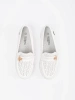 White lightweight loafers with a pin
