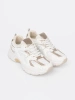 White sneakers with beige-gold inserts