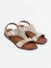 Gold sandals with openwork embellishments
