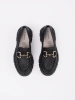 Black platform loafers with a gold chain