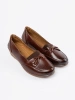 Brown slip-on loafers with a bow