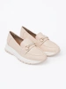 Light beige moccasins with decorative gold element