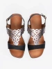 Black sandals with openwork embellishments