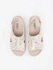 Light beige flat sandals with a buckle