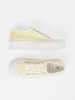 Yellow lace-up sneakers with a thick sole