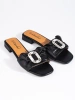 Black slip-on sandals with a bow