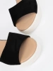 Black women's sandals on a white wedge