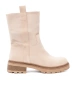 Modern light beige ankle boots in a simple style