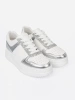 White silver sneakers with shimmering details