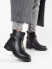 Black ankle boots with low heel decorated with straps