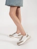 White-beige leather perforated sneakers on thick soles