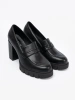 Black loafers with a column heel and jute sole