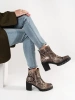 Heeled ankle boots in snake print