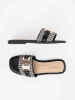 Black and white women's slides with a gold chain