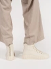 Light beige women's high-top sneakers on a platform