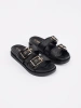 Black flat flip-flops with buckles
