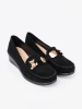 Black suede loafers with decorative bear