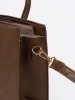Brown handbag with decorative gold buckle