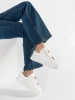 White platform sneakers with pins
