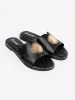 Black slides with gold embellishment