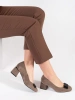 Beige block heeled pumps with a bow