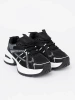 Black sneakers with breathable upper and chunky white sole