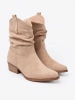 Beige women's ankle boots in a classic cut