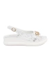 White flat sandals with embellishment