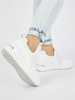 Białe sneakersy damskie na koturnie
