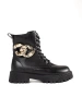 Black combat boots with a gold chain