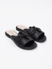 Black flat slides with a bow