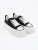 Black and white platform sneakers