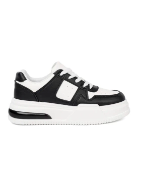 Stylish black and white sneakers with thick soles