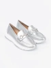 Silver moccasins with decorative gold element