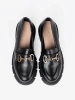 Classic black loafers with metal buckle