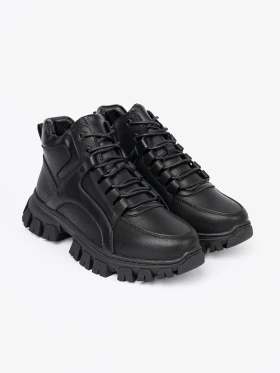 Black laced ankle boots with thick sole by Sergio Leone
