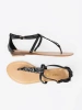 Black flat thong sandals