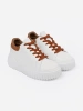 White sneakers with brown inserts