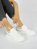 White Sneakers with a Green Accent