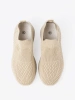 Light beige slip-on shoes made of breathable material