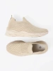 Light beige slip-on shoes made of breathable material