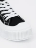 Black and white chunky sole sneakers