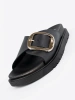 Black women's slides with a gold buckle