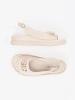 Beige sandals with embellishment
