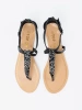 Black flat thong sandals