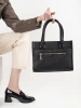 Black handbag with decorative zipper